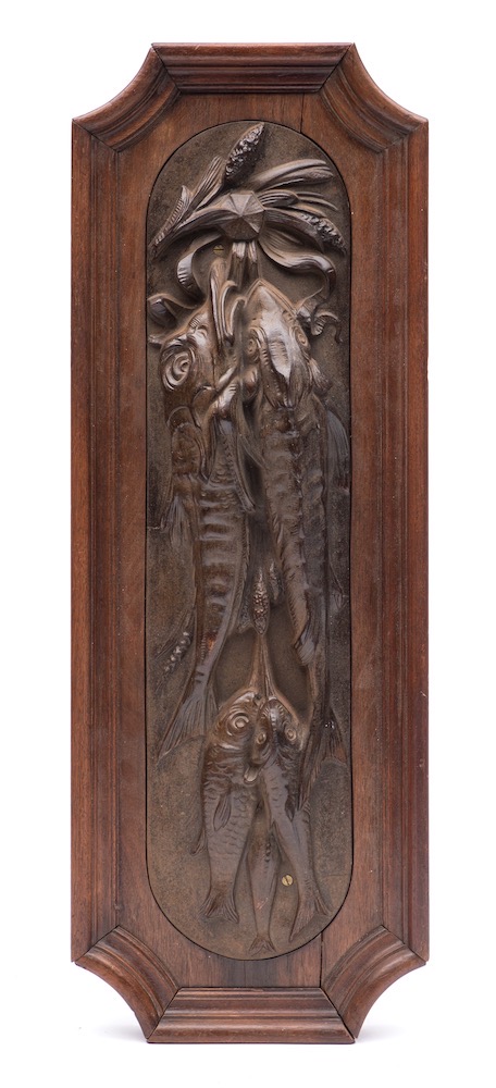 A cast iron wall relief of a brace of sturgeon, late 19th century,: with three smaller fish,