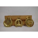 A collection of various early 20th century horse brasses:, including a foal anchor,