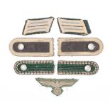 A group of German epaulette's and cloth insignia.