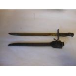 Japanese 30th Year type bayonet: with 40cm fullered blade, wood grips contained in a steel scabbard.