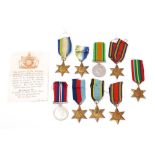 A group of eight WWII service medals and a reproduction Air Crew Europe Star.