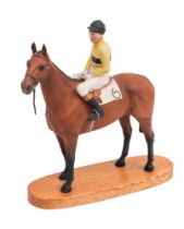A Beswick equestrian group: Arkle with Pat Taaffe up, on wooden base, [missing leather reins].