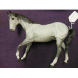 A Beswick model of a dapple grey horse,: 18cm high.