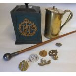 A RAF painted wood tea caddy: with applied RAF cyphers, assorted cap badges,