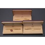 A Cross 2805 gold plated roller ball pen and two 2802 gold plated ball pens: cased (3)