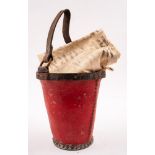An early 20th century red leather fire bucket and a post bag: (2)