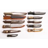 A collection of sheath knives: including a German made Bowie knife with simulated Stag grip and an
