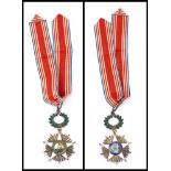 A Liberian Order of African Redemption sash and badge: with white enamel five pointed star,