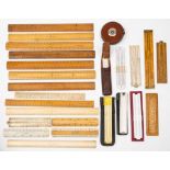 A collection of various boxwood and celluloid rules and slide rules: including a small slide rule