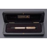 A Parker Duofold sterling silver roller ball pen,: cased.