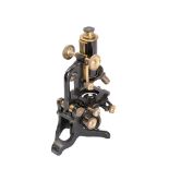 An early 20th century black lacquer laboratory microscope by G Baker, London: No. 6281.