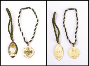 Two Royal Calcutta Turf Club enamel members badges: for 1926-27 and 1928-29 by Thomas Fatterini,