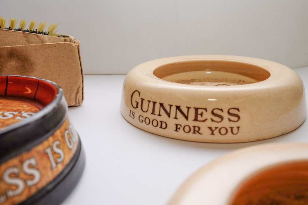 A group of five Guinness advertising ashtrays: together with a blue glaze Guinness water jug and a - Image 2 of 6