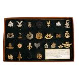 A collection of British and Commonwealth Regimental badges and buttons: including a 1st South