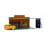 A Meccano tinplate 'Filling and Service Station' red, yellow and blue with lithograph detailing,