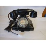 A model 232 bakelite telephone hand set: with integral drawer and braided handset cord. 23cm wide.