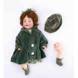 A Simon and Halbig bisque head doll,: applied brown wig, blue glass sleeping eyes,