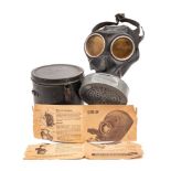 A WWII German RL 1 gas mask: the filter stamped with eagle and swastika emblem and numbered