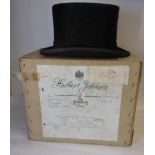 A Herbert Johnson moleskin & silk riders top hat:, contained in its original box.