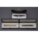 Two Parker Sonnet Dimonite roller ball pens: one in a red lacquer finish,