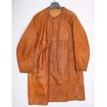 An early 20th century brown leather collarless motoring overcoat: unsigned.