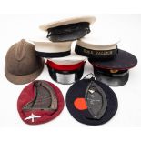 A collection of various caps and head dress: to include a blue Royal Marines beret dated '1945' and