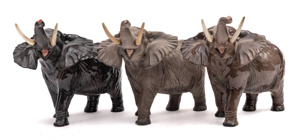 Three Beswick elephants: trunk stretching large, two under gloss, one under matt. - Image 2 of 2