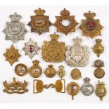 A collection of various Shako plates, Pugri badges: together with a Royal Artillery belt buckle,