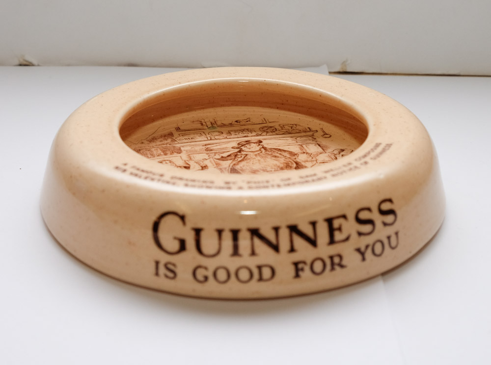 A group of five Guinness advertising ashtrays: together with a blue glaze Guinness water jug and a - Image 5 of 6