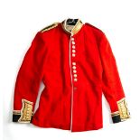 A Welsh Guard office full dress tunic with all buttons and epaulettes.