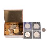 A collection of coins including an 1880 silver dollar and a 1773 George III evasion halfpenny.