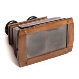 A 19th century walnut Brewster patter stereoscopic viewer: with ebony mounted eyepieces and