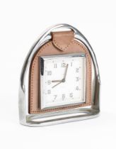A Smith Stirrup timepiece: the square eight day movement with Arabic numerals in leather suspension