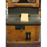 An oak cased 'National Electric' time clocking in clock by the National Time Recorder Co,