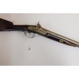 A 19th century side by side percussion cap shotgun: the plain 29 1/2 inch barrel with god inlaid