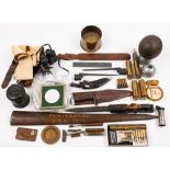 A collection of various militaria: to include a Sam Browne belt, WWII Gas mask, assorted belts,