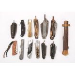 A collection of various folding knives,