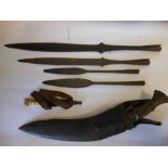 Four Naga Hills spearheads : together with a kukri contained in a leather scabbard and a bone