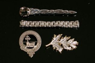 A silver McDonald Clan crest brooch,
