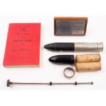 A group of assorted militaria: comprising a three rubber bullets, a staff car flag holder,
