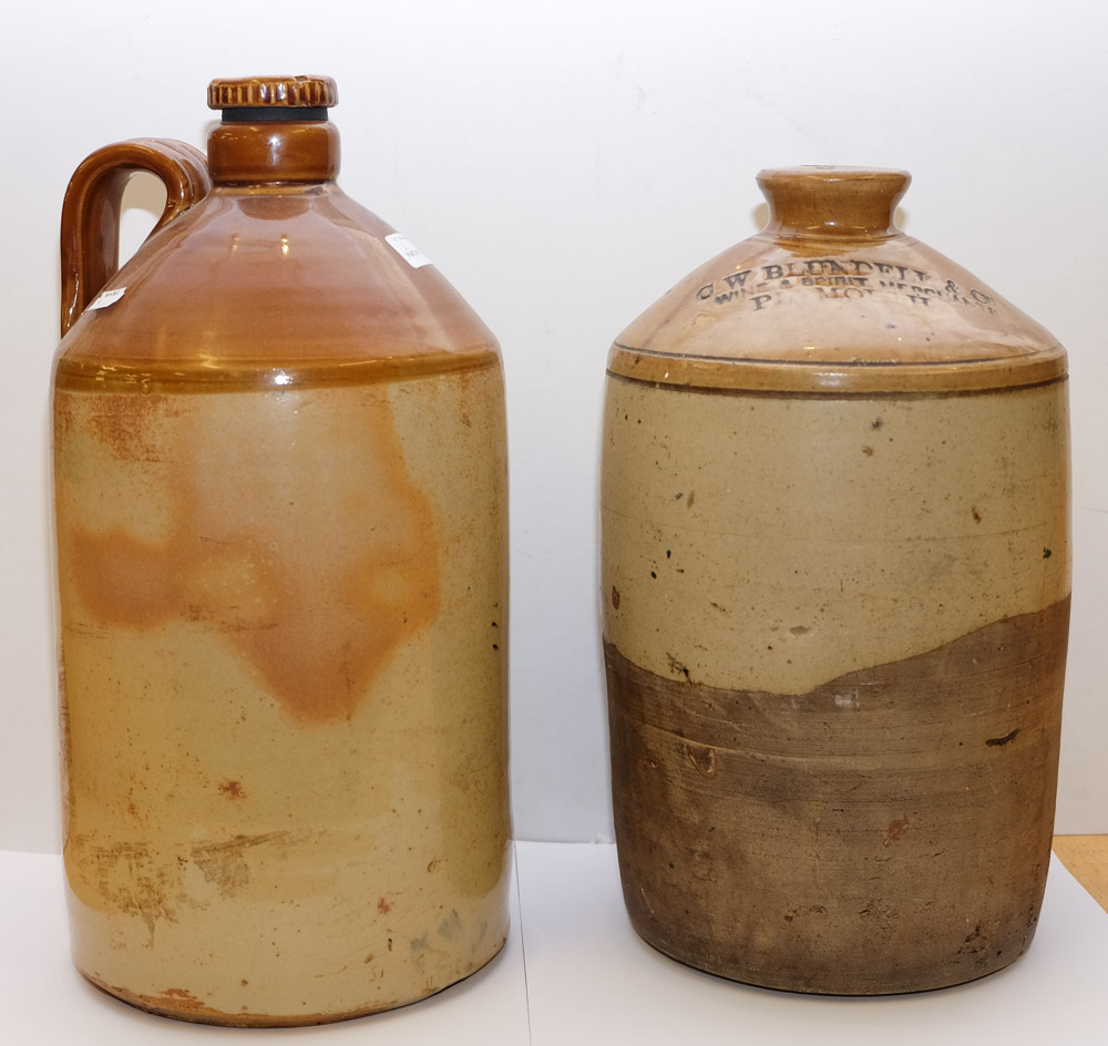 Two large stoneware bottles: one stamped 'C W Blundell & Co.