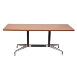 A North American walnut and metal mounted dining table by Herman Miller,