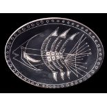 A Vallauris white earthenware dish: engraved with an abstract fish within a similar line and circle