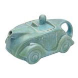 A Sadler racing car teapot: under mottled green glazes, impressed and printed marks, 24cm long.