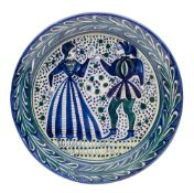 A Silves [Portuguese] art pottery charger: of circular form painted in blue and green on a cream
