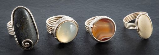 Helen Feilder, four rings with reeded bands,: set with various stones including banded agate,