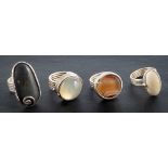 Helen Feilder, four rings with reeded bands,: set with various stones including banded agate,