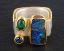 Tanja Ufer, a silver, boulder opal, sapphire and cabochon-cut emerald ring,