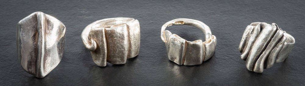 Four silver rings with folded decoration:, maker's mark 'BT', Birmingham, 1994-6,