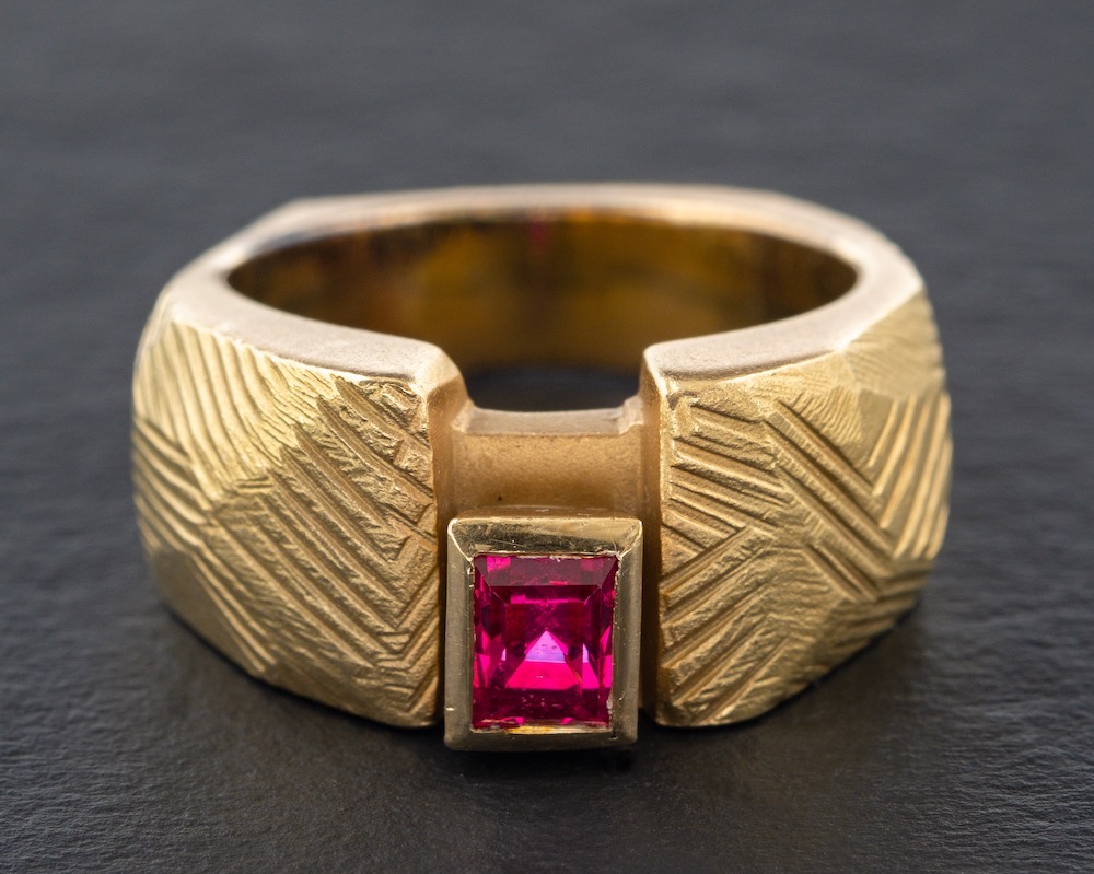 An 18ct gold, pink, rectangular, step-cut, synthetic spinel ring,